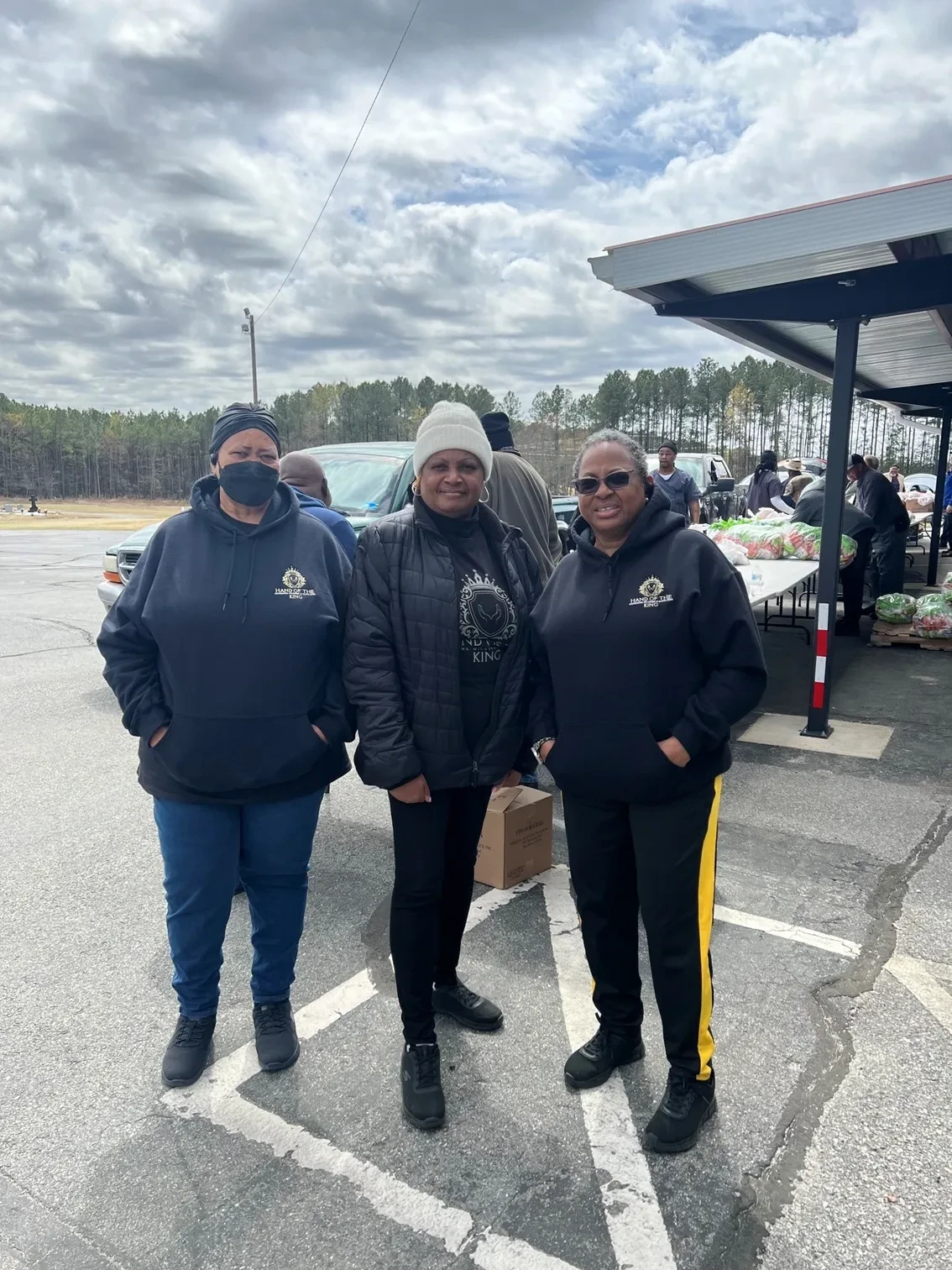 Hand of the King volunteers at a community food distribution event