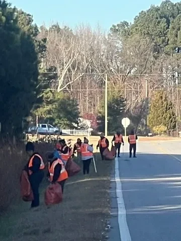 Volunteer group walking along the road during an Adopt-a-Highway cleanup