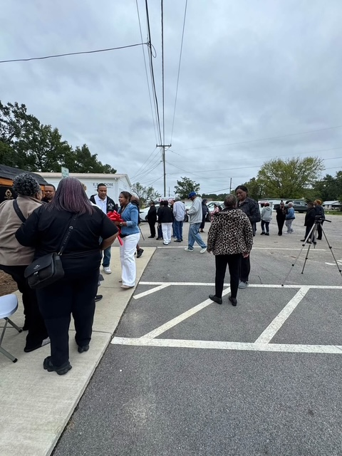Community members gathered in the parking lot for the King's Pantry dedication event