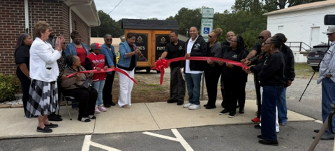 Hand of the King members cutting the ribbon at the King's Pantry dedication ceremony
