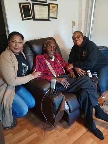 Hand of the King volunteers visiting an elder at home